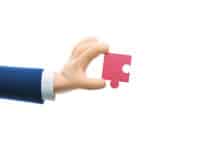 Docage en marque blanche Hand holding a puzzle piece